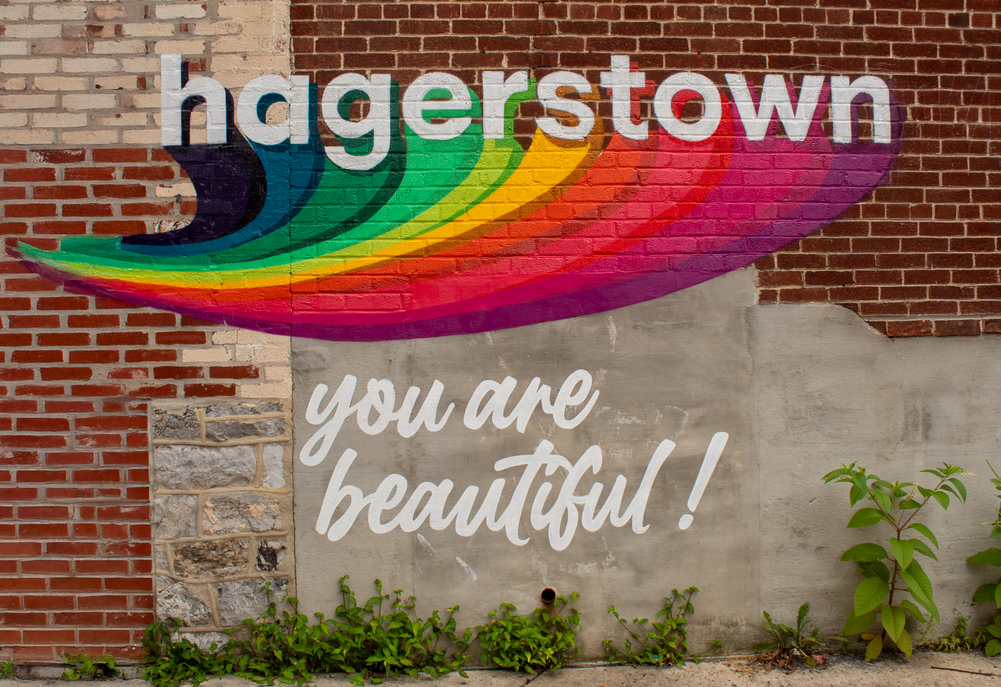 Public rainbow mural in Hagerstown, Maryland that says "you are beautiful."