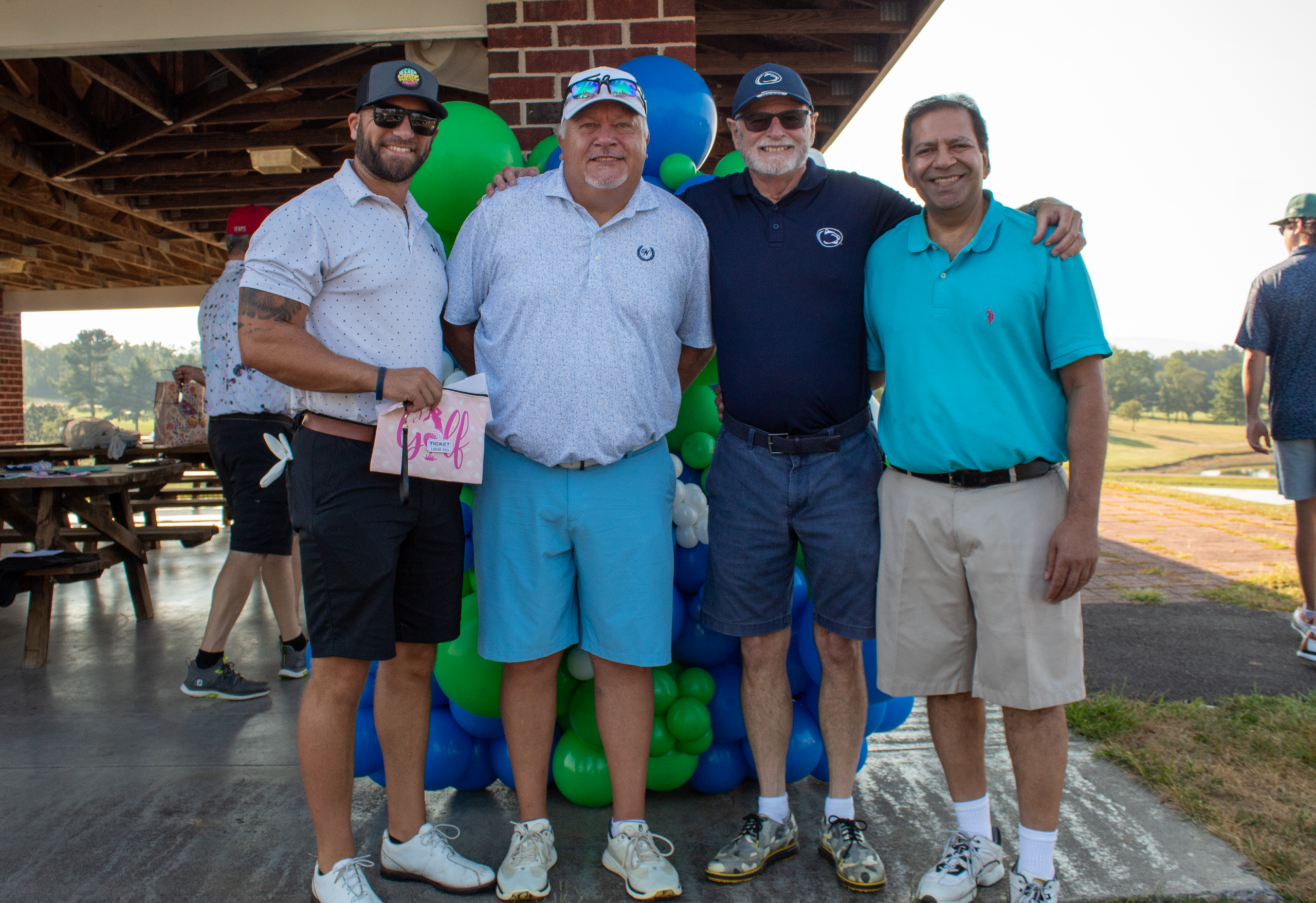 Golfer posing with Yosemite Sam golf club cover during the  CASA of Western Maryland Golf Tournament in 2025.