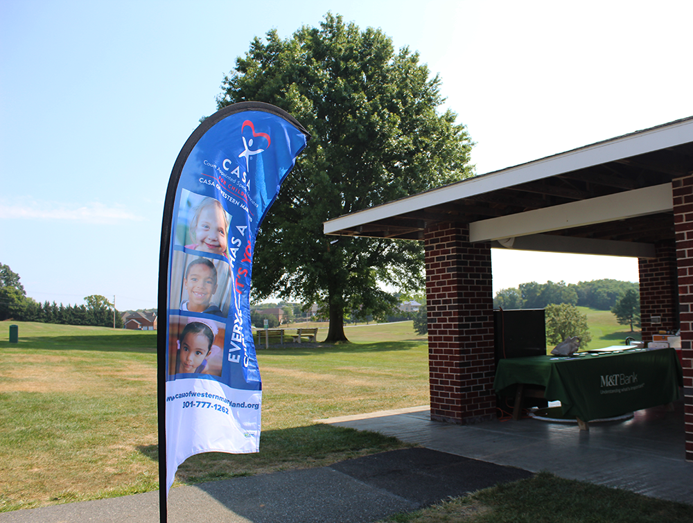 3rd Annual CASA of Western Maryland Golf Tournament (2025) CASA flag at registration table picture